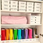 Mum shares organised games cupboard with coloured boxes and labels